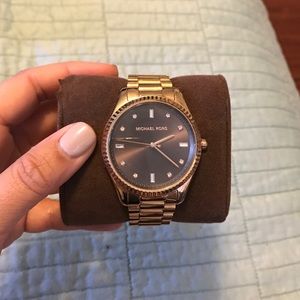 Michael Kors rose gold watch with diamond accents